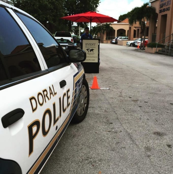 World Valet Parking with Cops Car and Portable Valet Podium